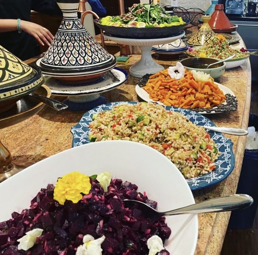 A buffet of tagines, couscous and beet salad.